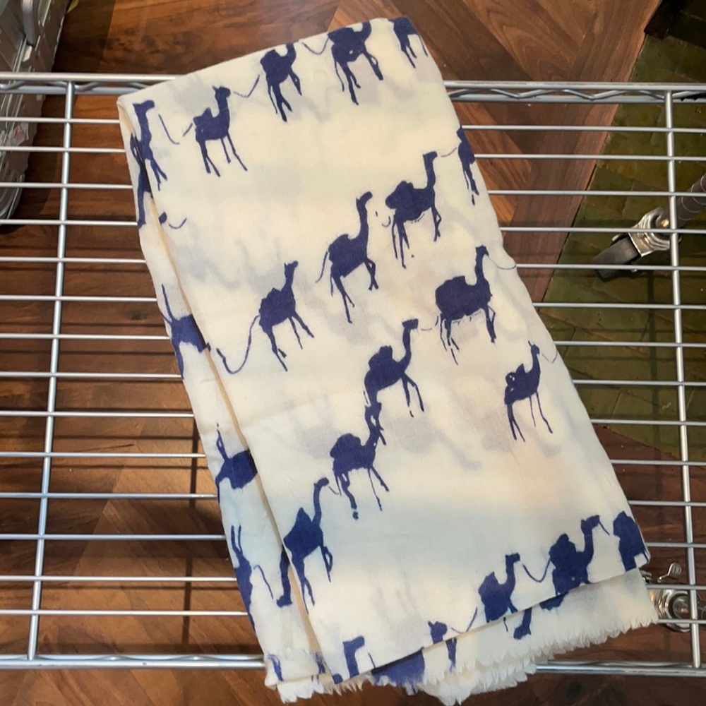 Scarf with blue camels on it.